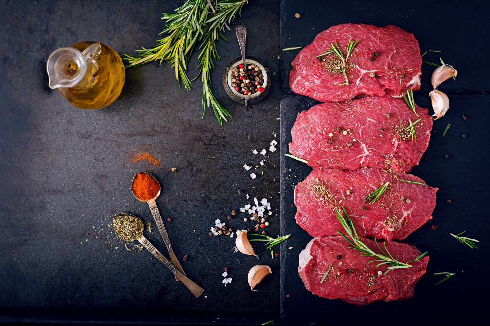 raw-beef-steaks-with-spices-and-rosemary-flat-lay-top-view.jpg
